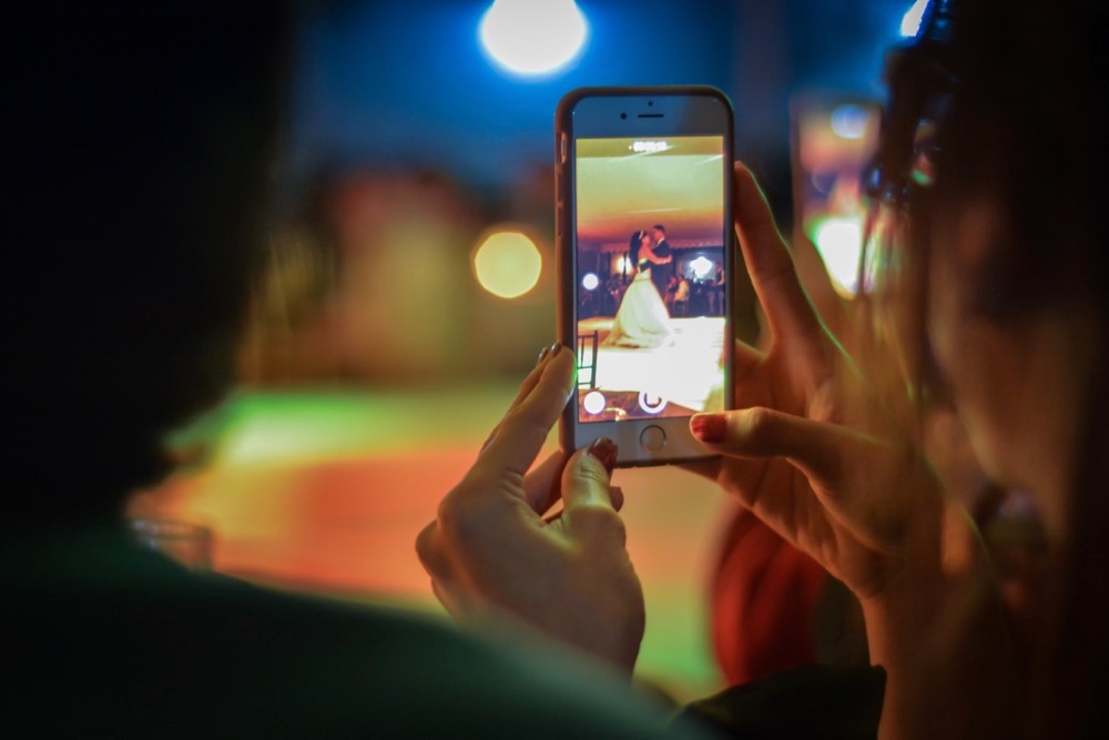 capturing first dance on mobile phone